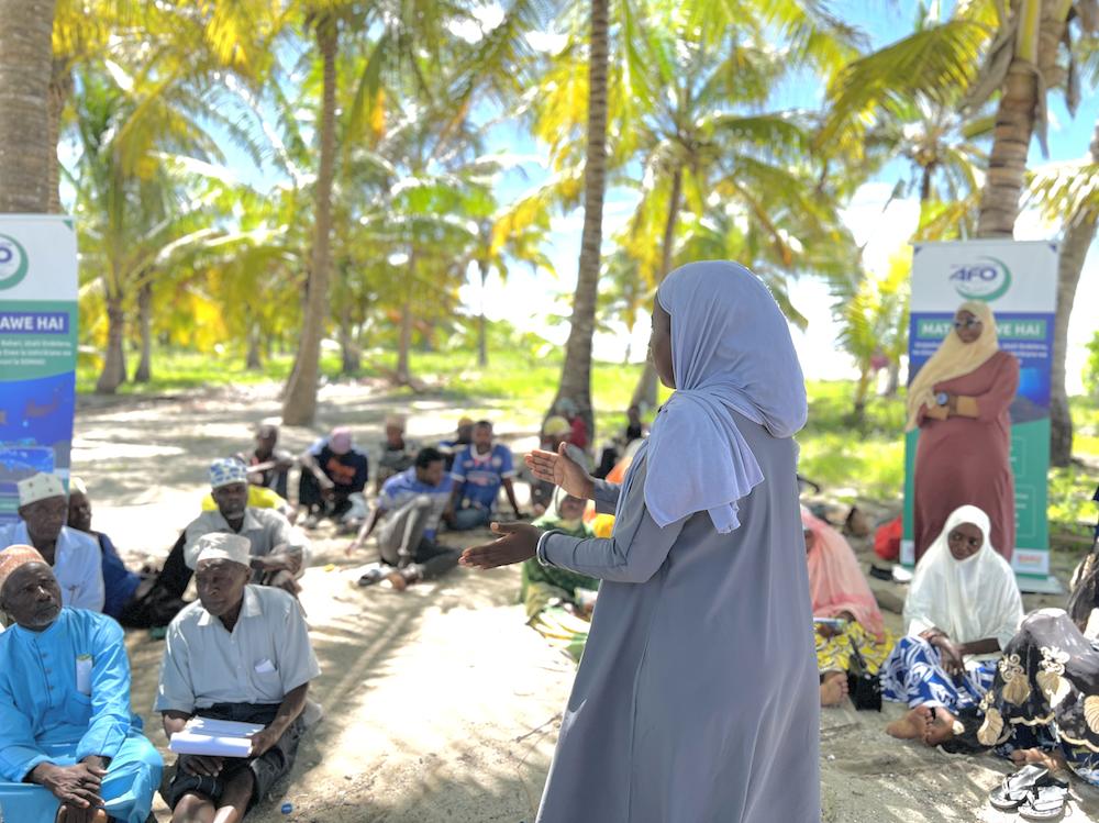 Woman talks with community members