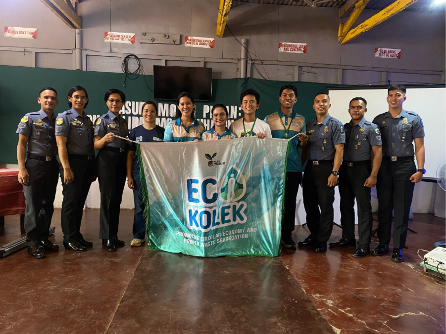 A group of people holding a banner.