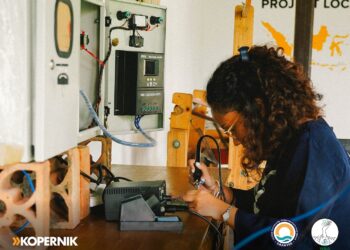 Women examining seaweed, Osi Island, Indonesia